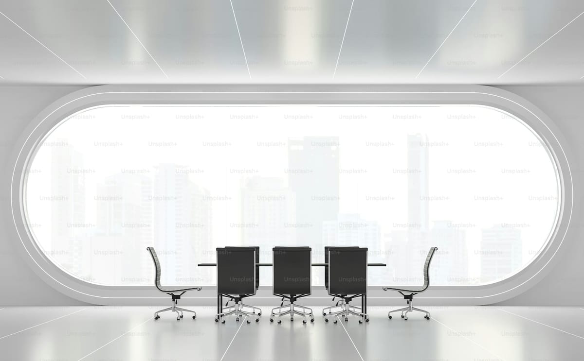Modern empty meeting room with arch windows overlooking a city skyline, the space where Discovery conversations happen